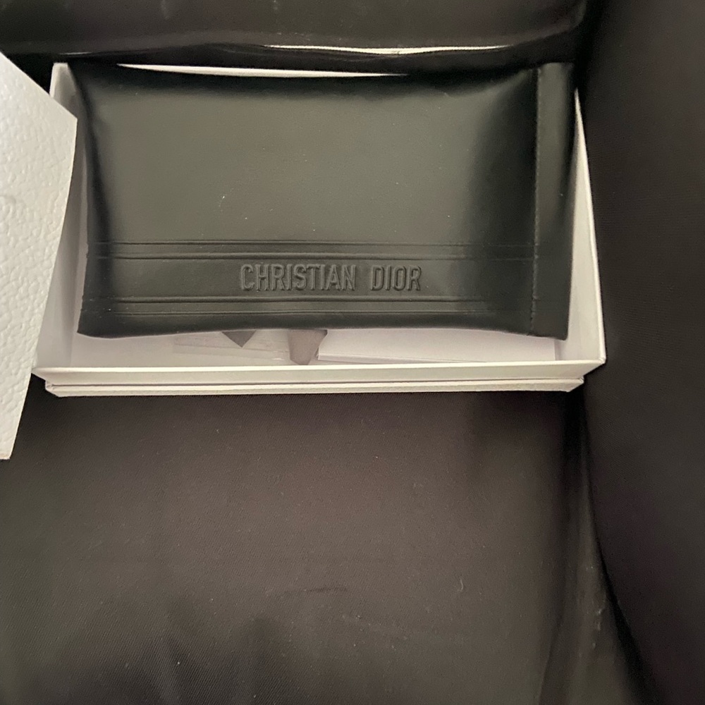 Gently used authentic Dior sunglasses with leather case.